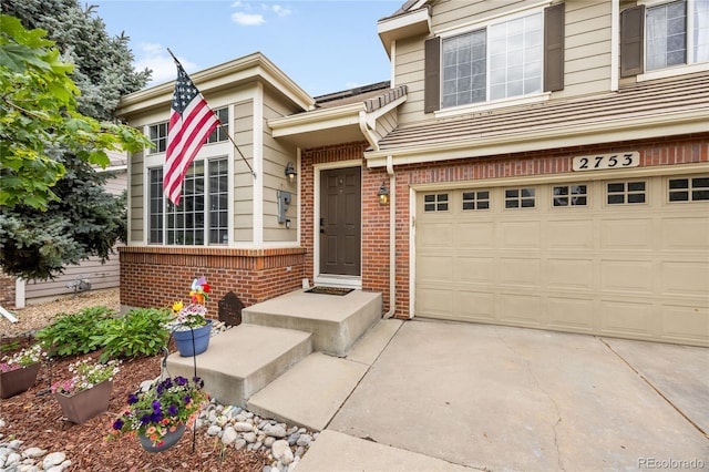 2753 E 139th Dr, Thornton, CO 80602 - view of front facade with brick siding, concrete driveway, and an attached garage