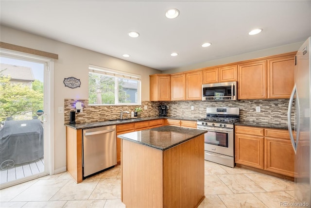 2753 E 139th Dr, Thornton, CO 80602 - kitchen featuring appliances with stainless steel finishes, decorative backsplash, dark stone countertops, a center island, and recessed lighting