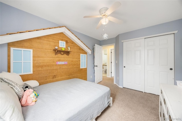 2753 E 139th Dr, Thornton, CO 80602 - bedroom with light colored carpet, wooden walls, a closet, ceiling fan, and lofted ceiling