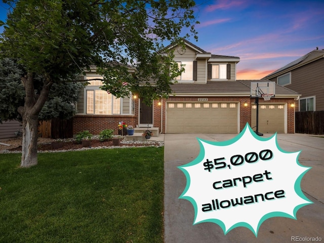2753 E 139th Dr, Thornton, CO 80602 - view of front of house with brick siding, driveway, and a garage
