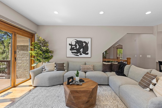 living room featuring a wealth of natural light and recessed lighting