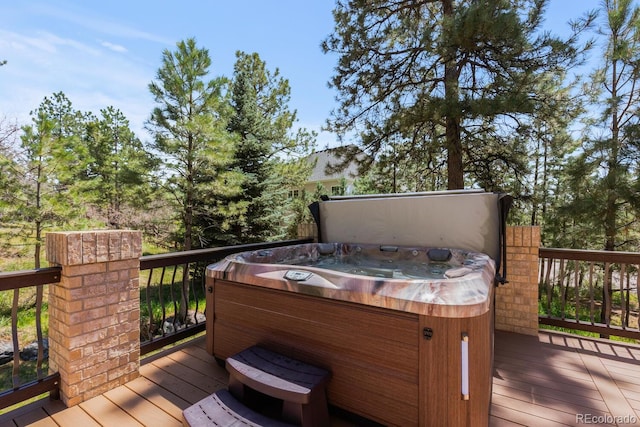 deck featuring a hot tub