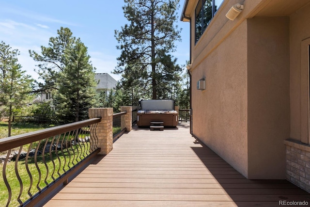 deck featuring a hot tub
