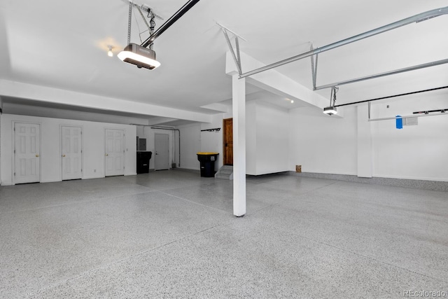 garage featuring baseboards and a garage door opener