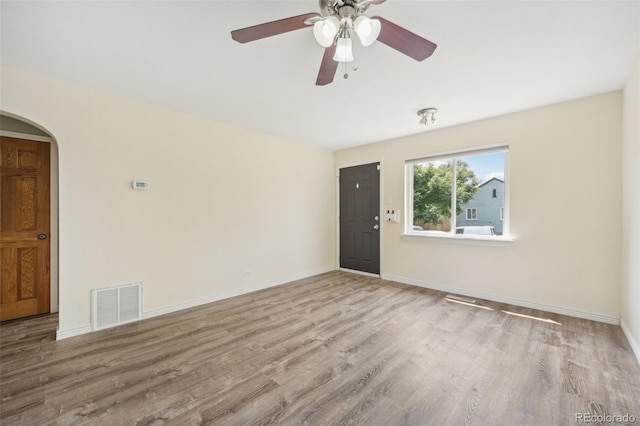 spare room with light hardwood / wood-style floors and ceiling fan