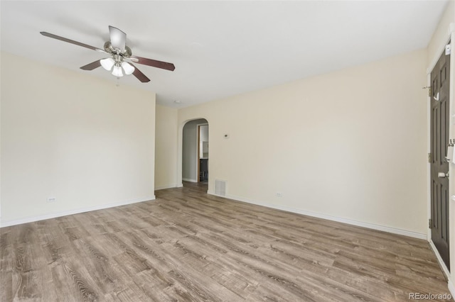 unfurnished room featuring ceiling fan and light wood-type flooring