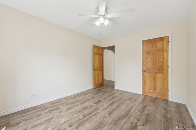 unfurnished bedroom with light hardwood / wood-style floors and ceiling fan