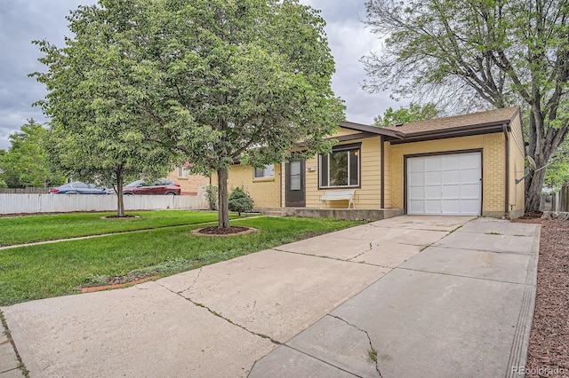 7618 Umatilla St, Denver, CO 80221 - view of front facade featuring an attached garage, concrete driveway, and brick siding
