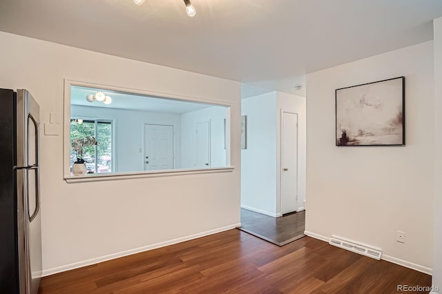 7618 Umatilla St, Denver, CO 80221 - empty room with wood finished floors and baseboards
