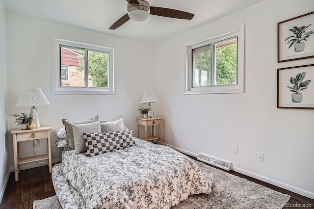 7618 Umatilla St, Denver, CO 80221 - bedroom with multiple windows, baseboards, and wood finished floors