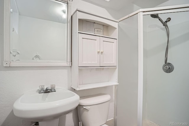 7618 Umatilla St, Denver, CO 80221 - full bathroom with a stall shower, toilet, and a sink