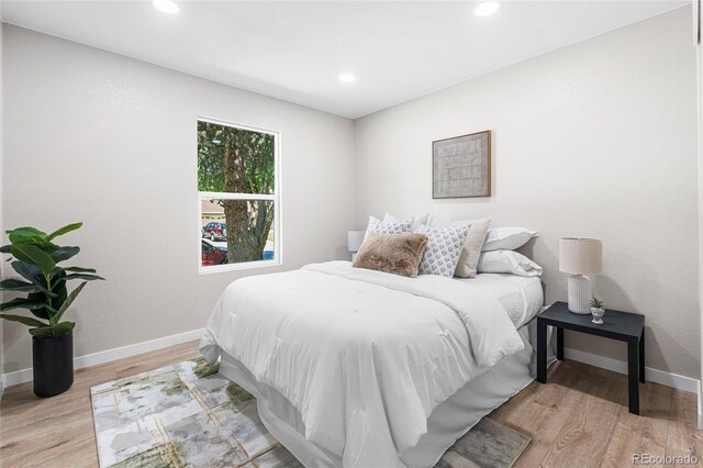 2260 S Lewiston St, Aurora, CO 80013 - bedroom with wood finished floors and recessed lighting
