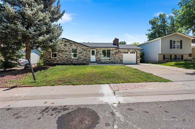 2260 S Lewiston St, Aurora, CO 80013 - view of front of home with a chimney, concrete driveway, a garage, stone siding, and a front lawn