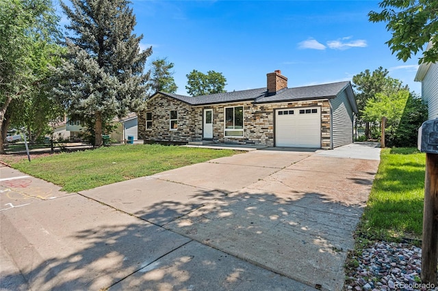 2260 S Lewiston St, Aurora, CO 80013 - view of front facade with an attached garage, a chimney, a front lawn, driveway, and stone siding