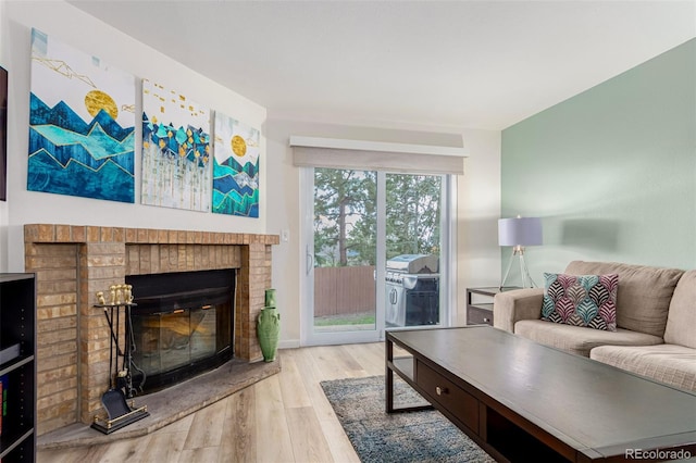 11147 W 17th Ave Unit 103, Lakewood, CO 80215 - living room featuring wood finished floors and a fireplace