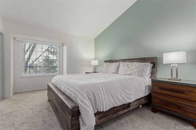 11147 W 17th Ave Unit 103, Lakewood, CO 80215 - carpeted bedroom with baseboards and lofted ceiling