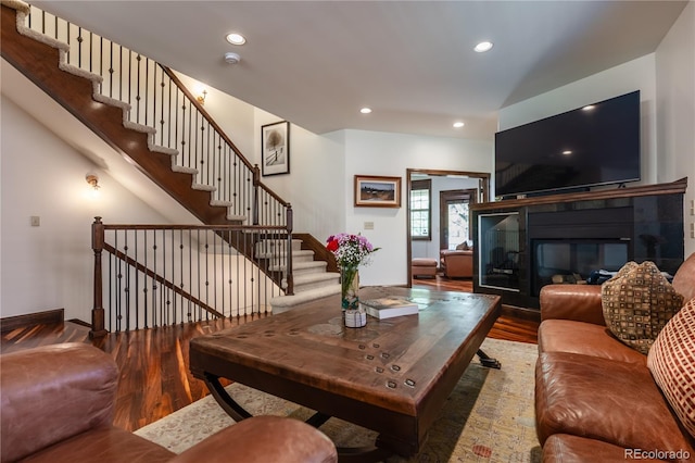 690 S Emerson St, Denver, CO 80209 - living area featuring wood finished floors, recessed lighting, stairs, and a tile fireplace