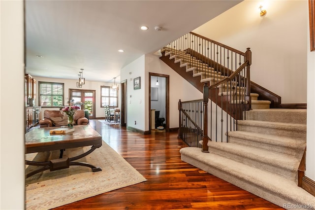 690 S Emerson St, Denver, CO 80209 - living area with wood finished floors, stairway, recessed lighting, and a chandelier