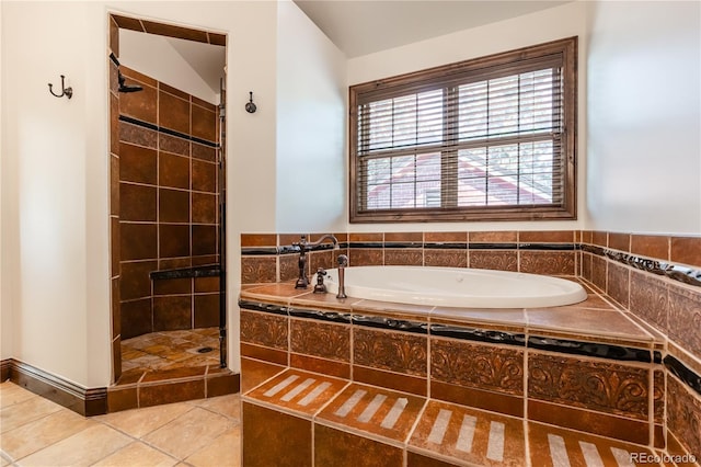 690 S Emerson St, Denver, CO 80209 - bathroom featuring a garden tub, a stall shower, and tile patterned floors