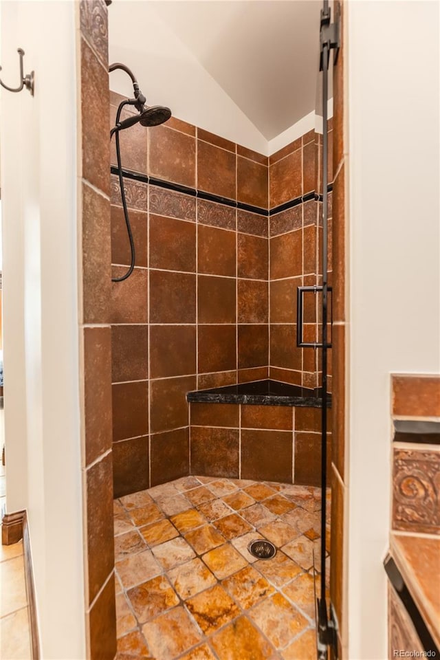 690 S Emerson St, Denver, CO 80209 - full bathroom featuring tiled shower and lofted ceiling