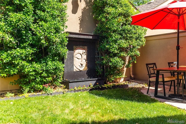 690 S Emerson St, Denver, CO 80209 - property entrance with stucco siding and a lawn