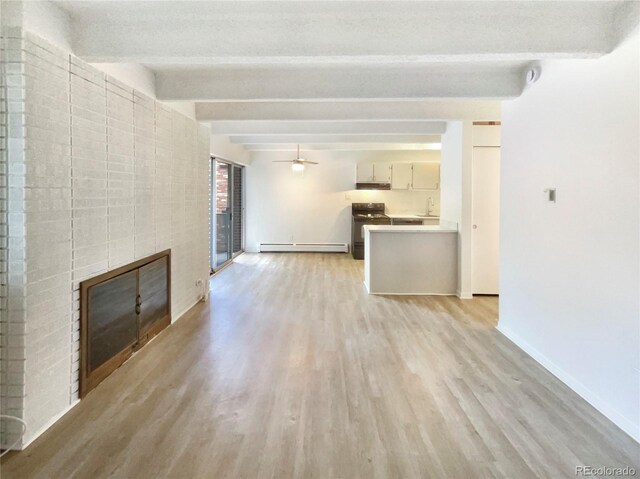 2401 S Gaylord St Unit 206, Denver, CO 80210 - unfurnished living room with light wood finished floors, a fireplace, baseboard heating, beamed ceiling, and ceiling fan