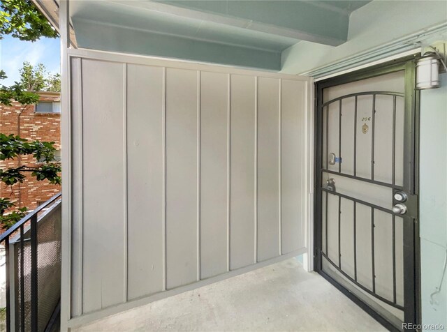 2401 S Gaylord St Unit 206, Denver, CO 80210 - property entrance with board and batten siding