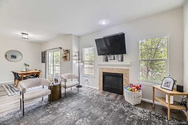 6819 S Webster St Unit B, Littleton, CO 80128 - living room with a tile fireplace and wood finished floors
