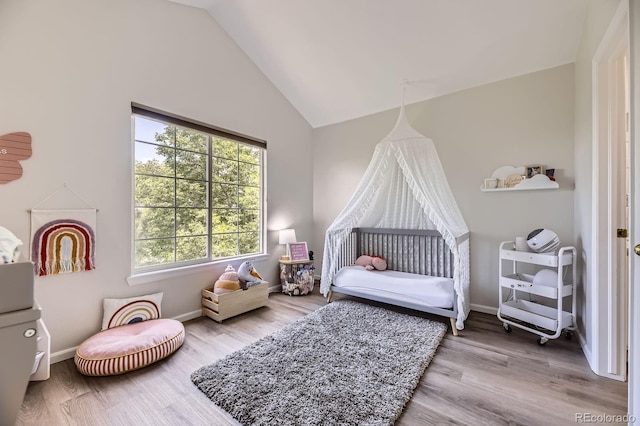 6819 S Webster St Unit B, Littleton, CO 80128 - bedroom featuring lofted ceiling and wood finished floors