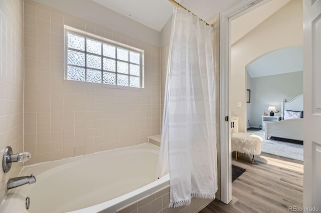 6819 S Webster St Unit B, Littleton, CO 80128 - full bath with connected bathroom, shower / bath combo with shower curtain, and wood finished floors
