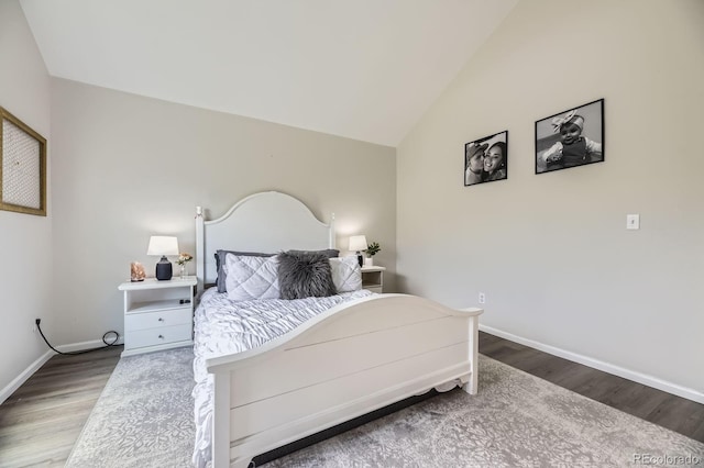 6819 S Webster St Unit B, Littleton, CO 80128 - bedroom with wood finished floors and vaulted ceiling