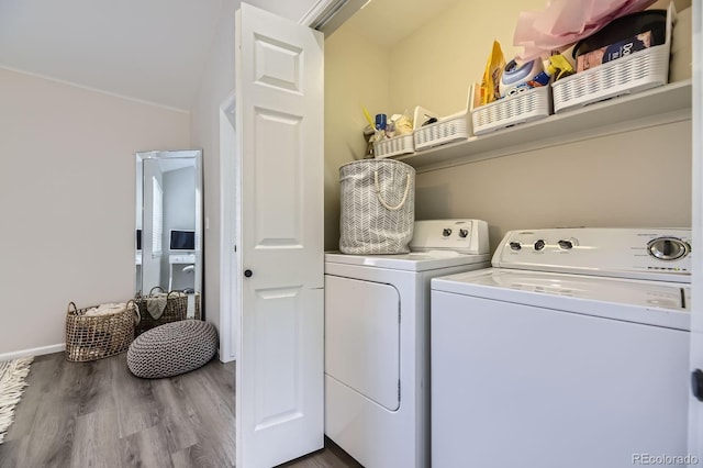 6819 S Webster St Unit B, Littleton, CO 80128 - laundry area with washing machine and dryer and wood finished floors