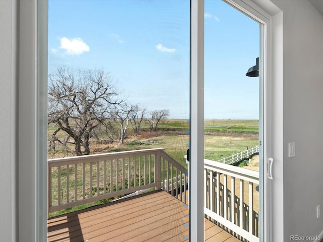 wooden deck featuring a view of countryside