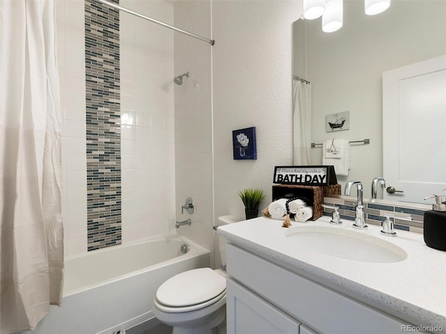 bathroom featuring shower / bath combo, vanity, and toilet