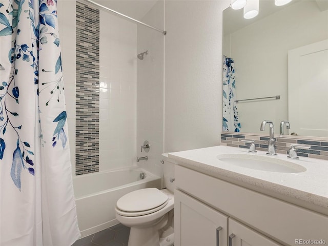 full bathroom featuring toilet, vanity, backsplash, tile patterned floors, and shower / bath combination with curtain