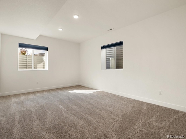 unfurnished room with recessed lighting, carpet flooring, and baseboards