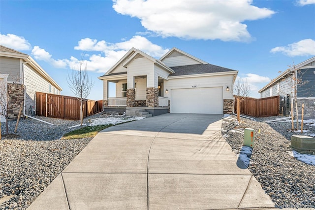 view of front of property with covered porch and a garage