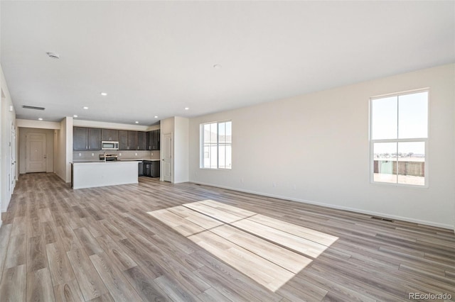 unfurnished living room featuring light wood-type flooring