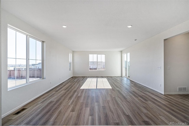 empty room featuring dark wood-type flooring