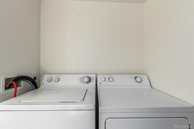 laundry area with washing machine and dryer