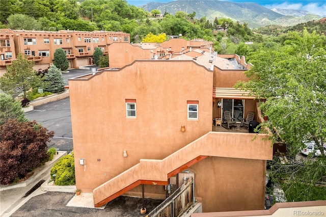 10 Taos Pl, Manitou Springs, CO 80829 - back of property with a mountain view and stucco siding