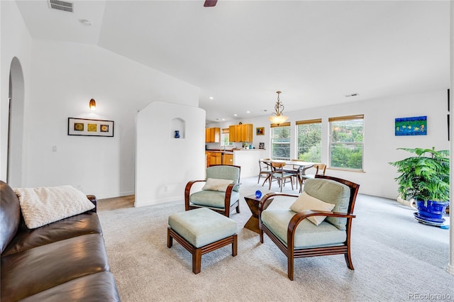 10 Taos Pl, Manitou Springs, CO 80829 - living room with arched walkways, light colored carpet, recessed lighting, and vaulted ceiling