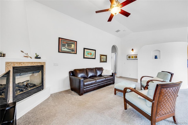 10 Taos Pl, Manitou Springs, CO 80829 - living room featuring arched walkways, carpet flooring, ceiling fan, lofted ceiling, and a glass covered fireplace