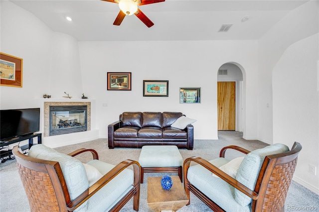 10 Taos Pl, Manitou Springs, CO 80829 - living area featuring arched walkways, a fireplace, carpet floors, a ceiling fan, and recessed lighting