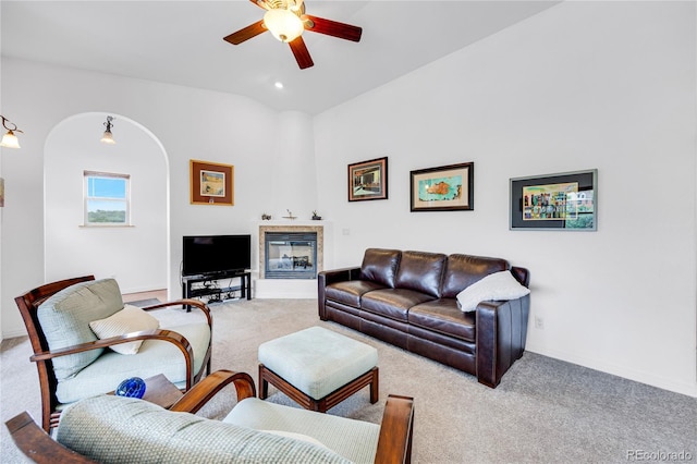 10 Taos Pl, Manitou Springs, CO 80829 - living area with a ceiling fan, carpet flooring, arched walkways, recessed lighting, and vaulted ceiling
