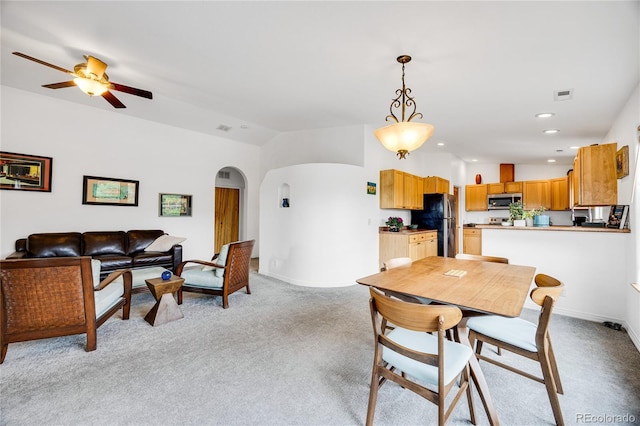 10 Taos Pl, Manitou Springs, CO 80829 - dining room with arched walkways, light carpet, a ceiling fan, recessed lighting, and lofted ceiling