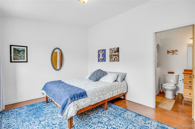10 Taos Pl, Manitou Springs, CO 80829 - bedroom featuring connected bathroom and wood finished floors