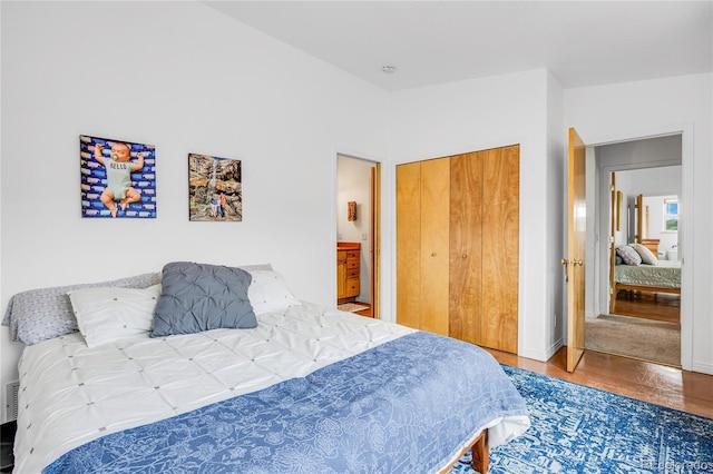 10 Taos Pl, Manitou Springs, CO 80829 - bedroom featuring a closet, wood finished floors, and connected bathroom