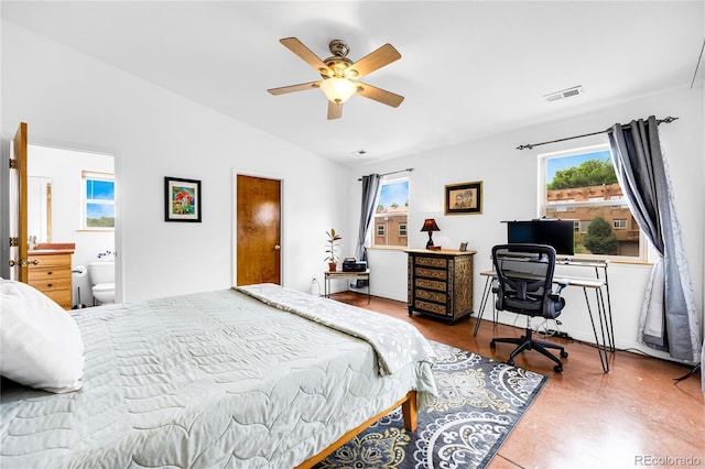 10 Taos Pl, Manitou Springs, CO 80829 - bedroom with multiple windows, vaulted ceiling, an office area, ceiling fan, and ensuite bathroom