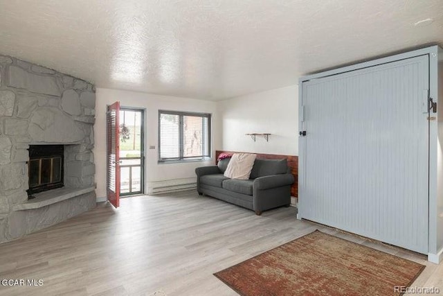 62927 US Highway 40 Unit 127, Granby, CO 80446 - living room featuring wood finished floors and a fireplace